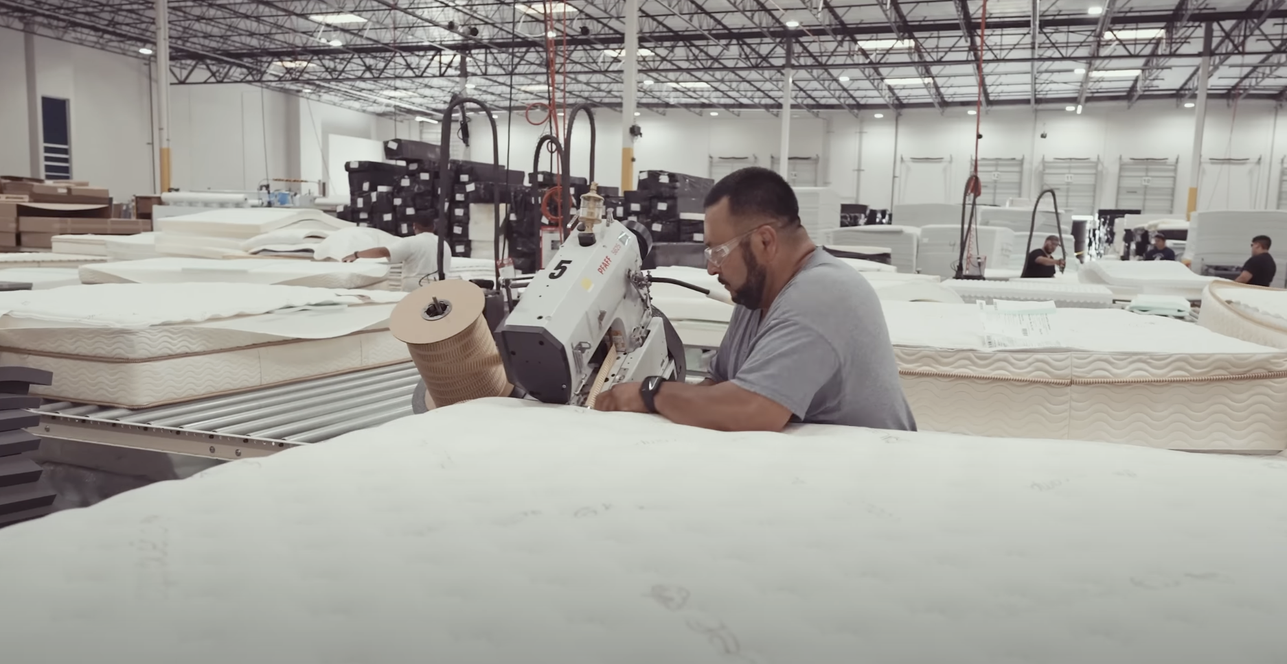 man at saatva mattress factory