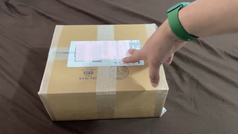 hand touching a package