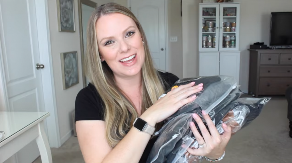 woman showing her purchases of Kindred Bravely Haul, luxury maternity & postpartum