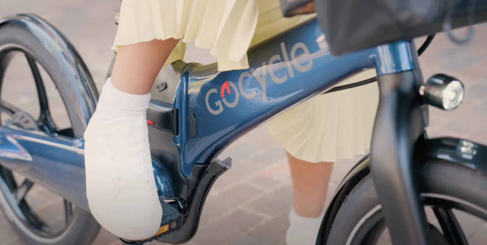 foot pedaling blue GoCycle ...
